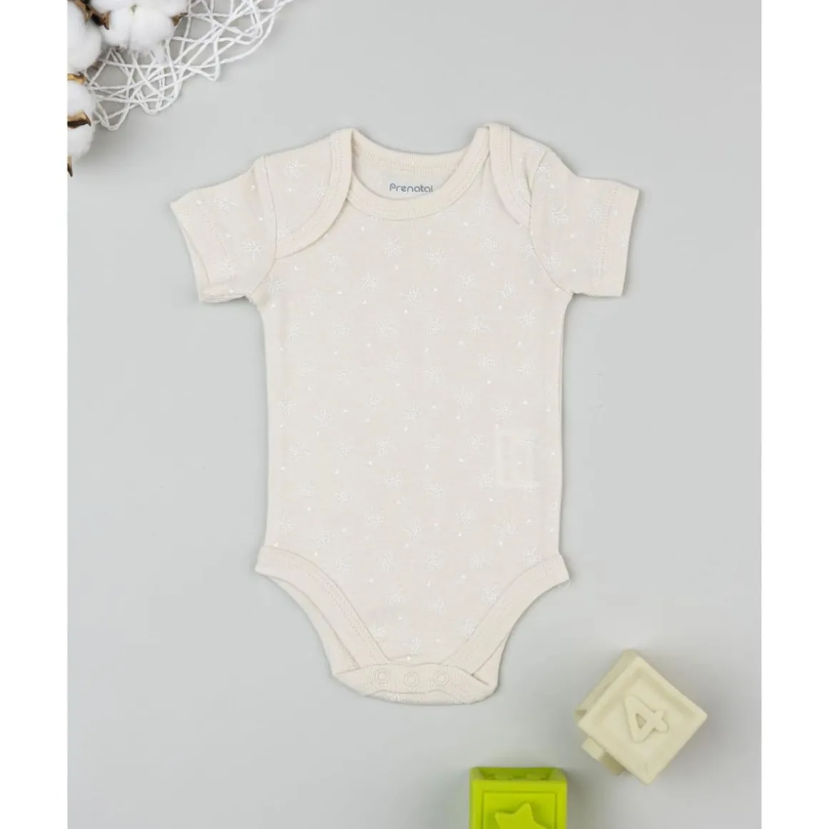 Body beige de manga corta para bebé con estampado floral