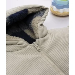 Chaqueta reversible beige con capucha para niño