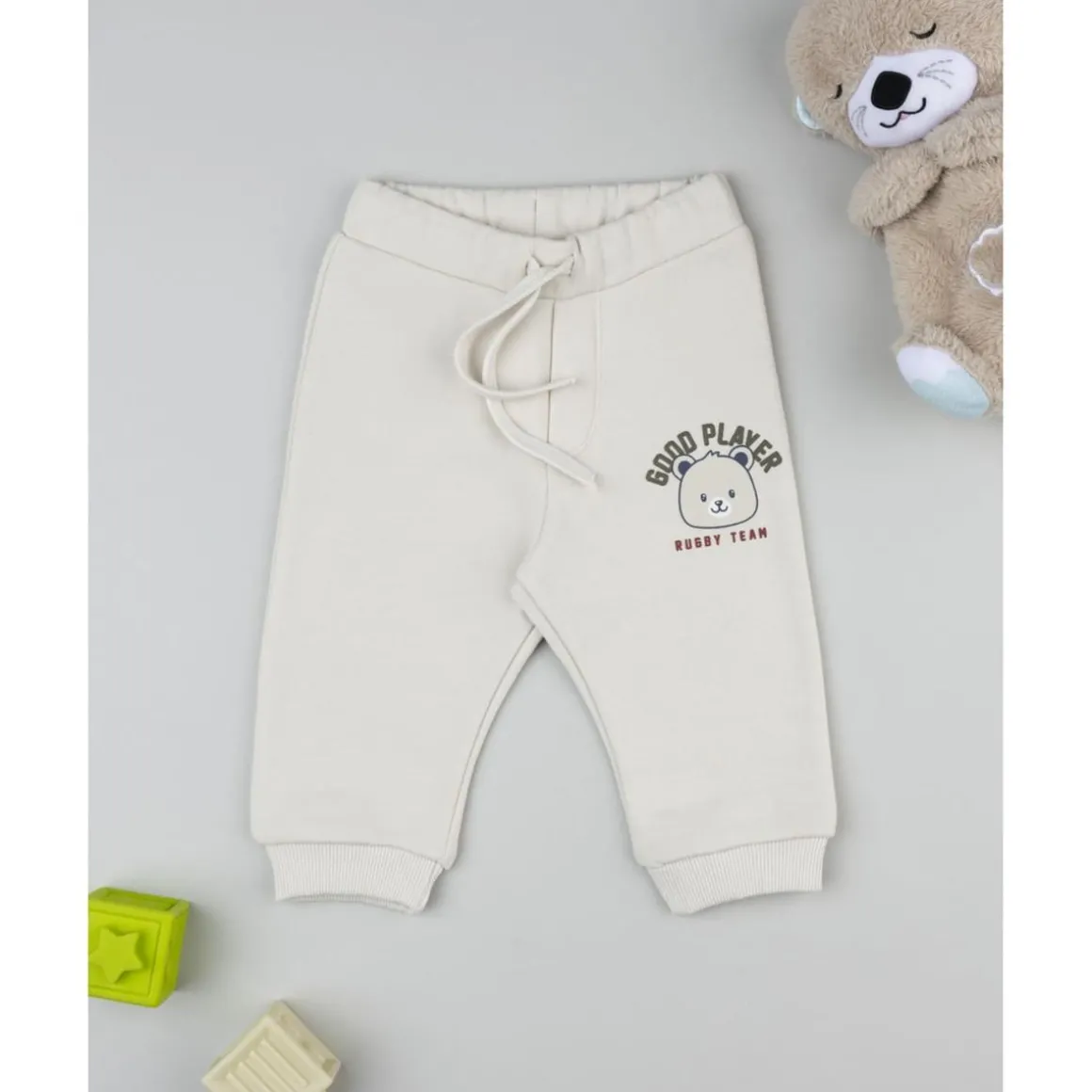 Pantalón beige con estampado para niño