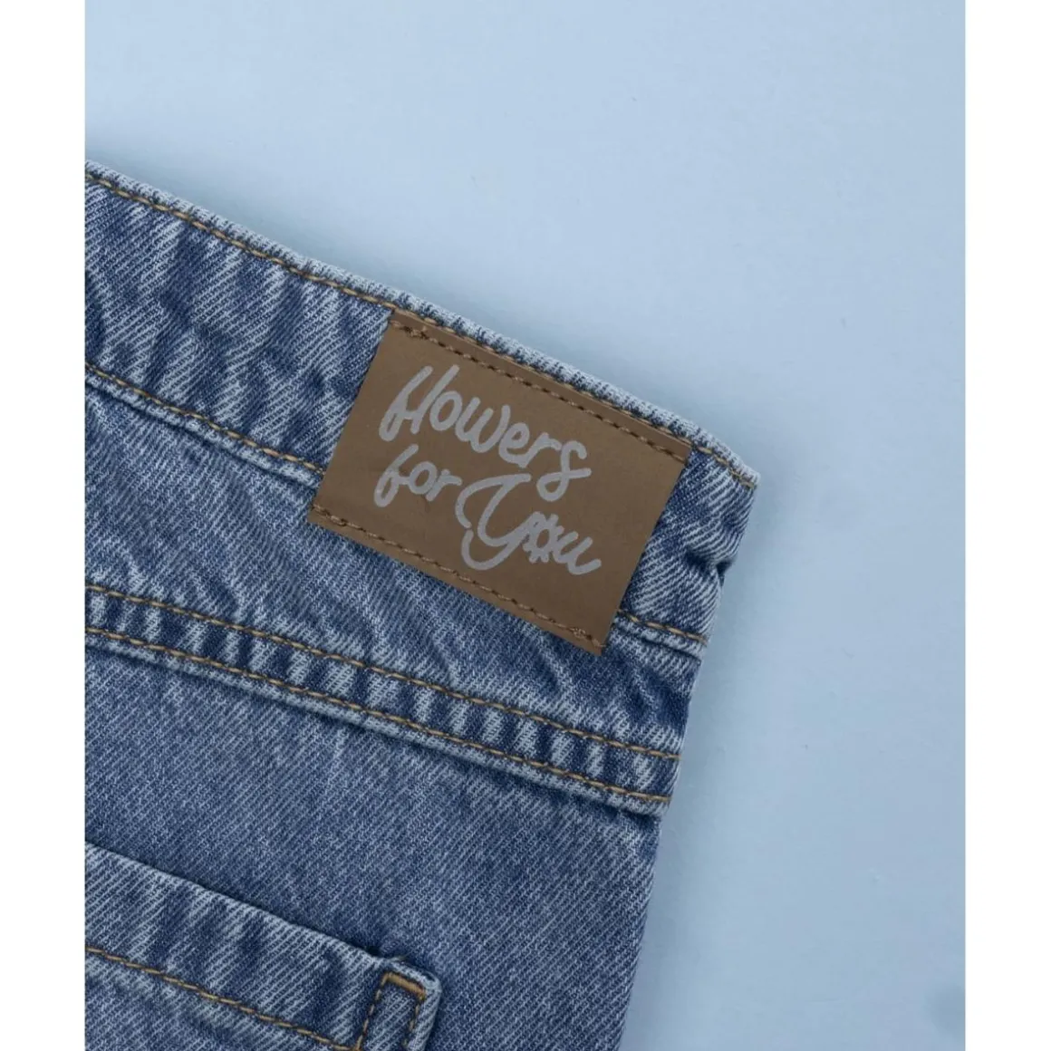 Pantalón denim niña florecitas