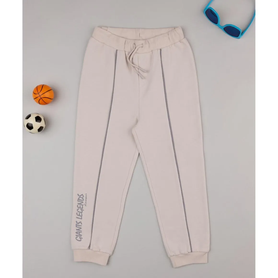 Pantalones niño beige dinosaurios
