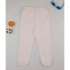 Pantalones niño beige dinosaurios