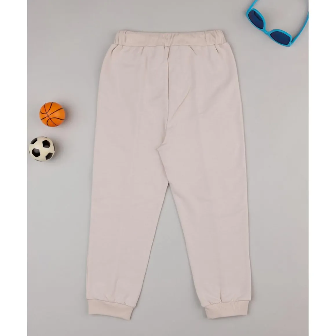 Pantalones niño beige dinosaurios