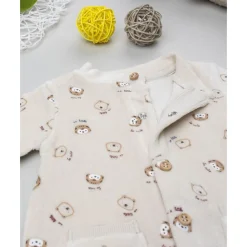 Pelele de terciopelo beige con estampado animalitos