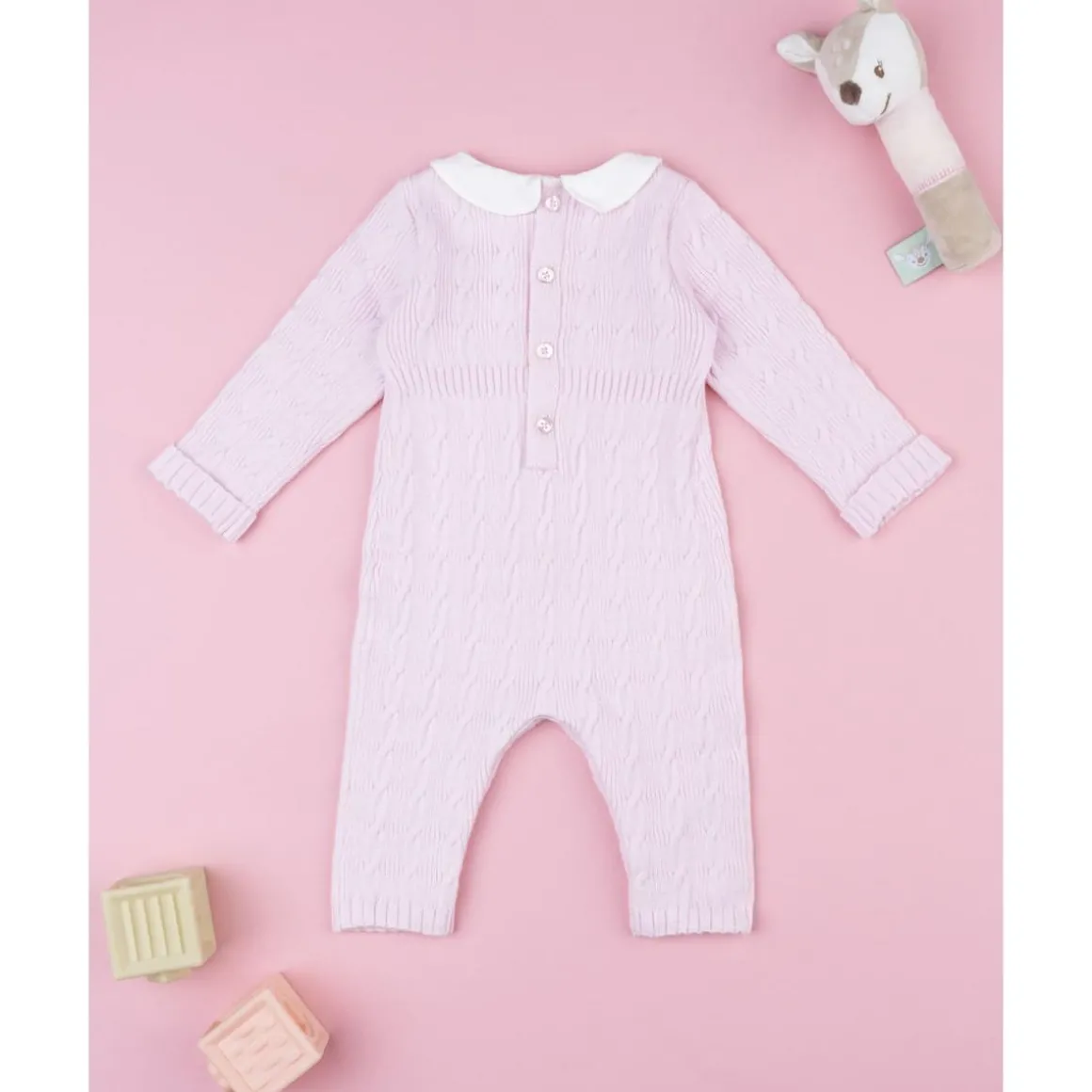 Pelele tricot rosa de niña con lazo