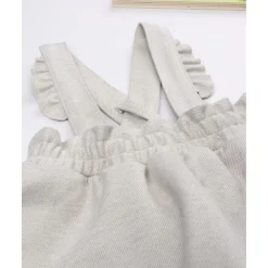 Peto con falda niña beige con bordados