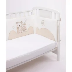 Protector de cuna con detalles en beige